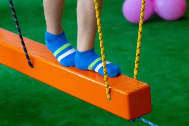 Children's feet at the playground with swinging bridge Children's feet at the playground with swinging bridge. Favorable Risk Profiles stock pictures, royalty-free photos & images